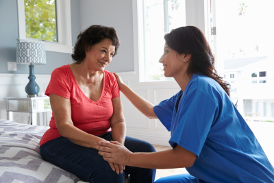 nurse making home visit to senior